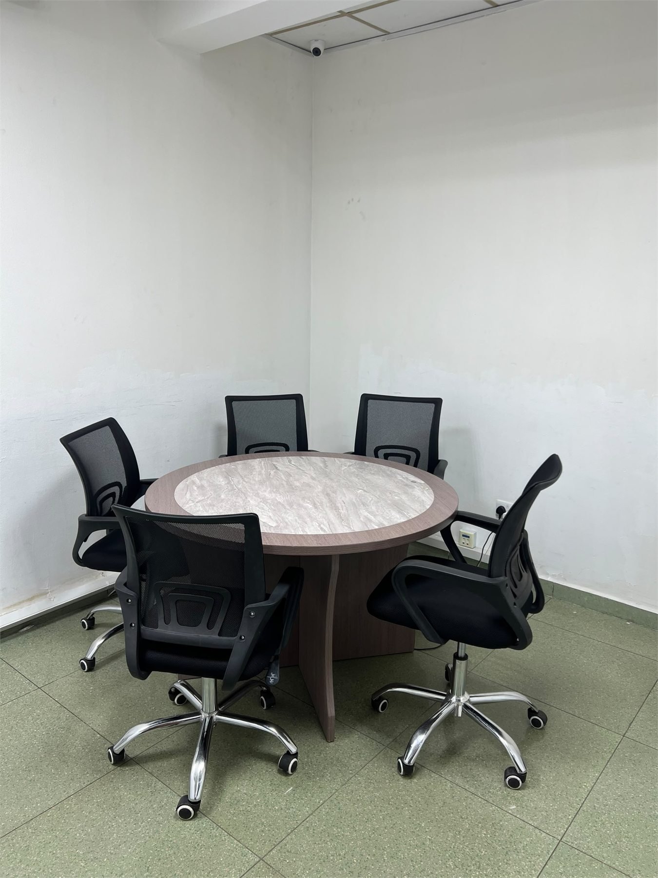 Round meeting table and chairs at Excel Global Serviced Office