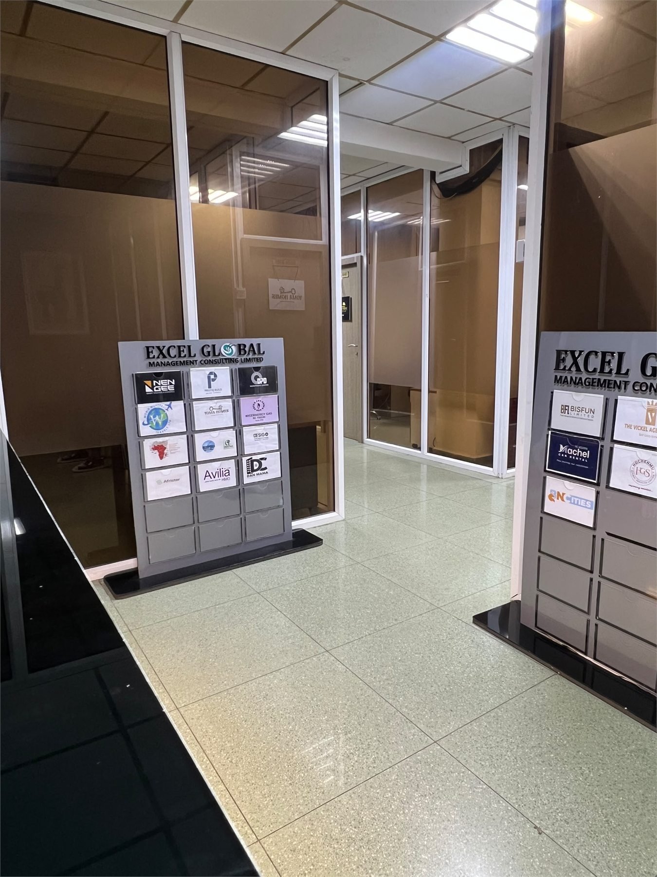 Glass-partitioned entrance to Excel Global Serviced Office
